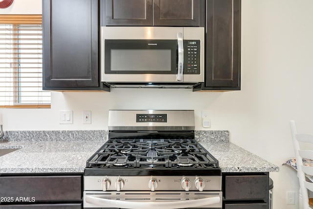 293 S Meadowood Ln, Sierra Vista, AZ 85635 - kitchen with stainless steel appliances and dark brown cabinetry