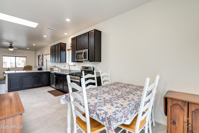293 S Meadowood Ln, Sierra Vista, AZ 85635 - dining area with ceiling fan, recessed lighting, and a skylight