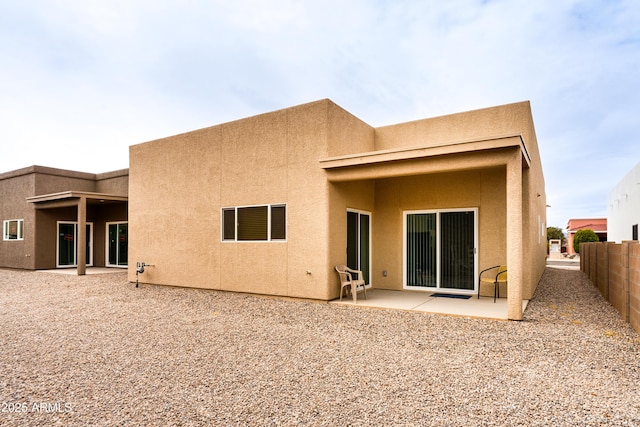 293 S Meadowood Ln, Sierra Vista, AZ 85635 - back of house featuring fence, stucco siding, and a patio area