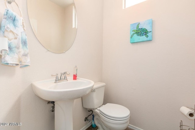 bathroom with toilet and sink