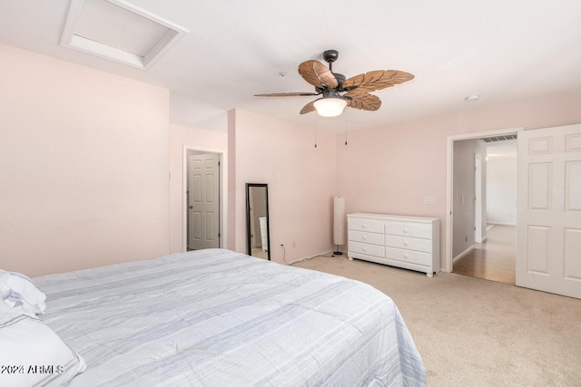 bedroom with ceiling fan and light carpet