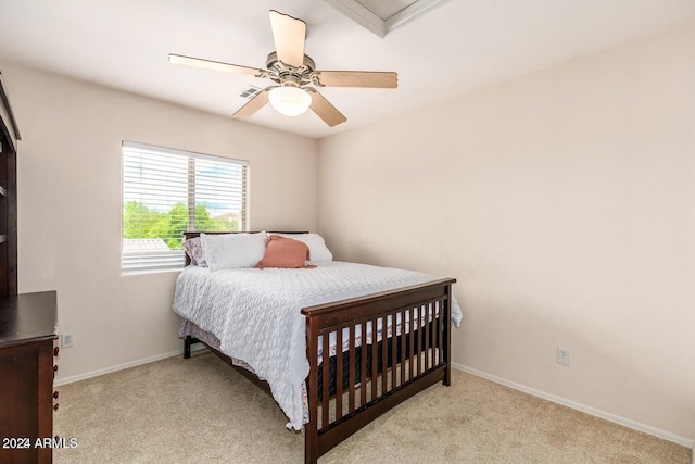 carpeted bedroom with ceiling fan