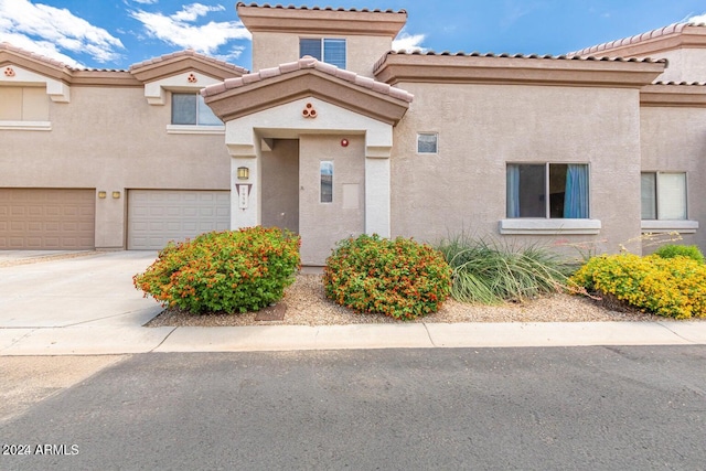 doorway to property featuring a garage