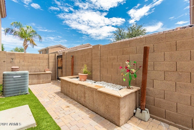 view of patio with central AC