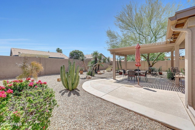 fenced backyard with a patio