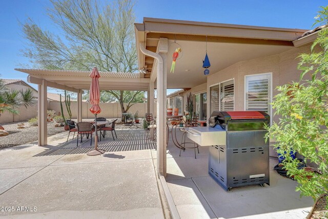 view of patio / terrace with outdoor dining space and a fenced backyard