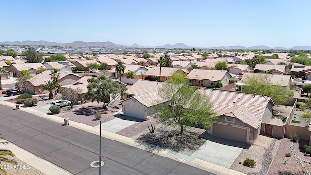 aerial view of residential area with a mountainous background