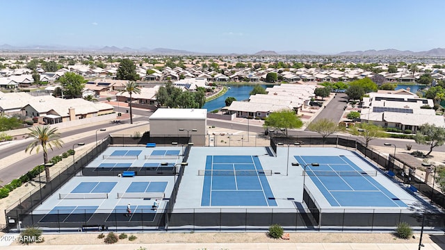 aerial perspective of suburban area featuring a water and mountain view