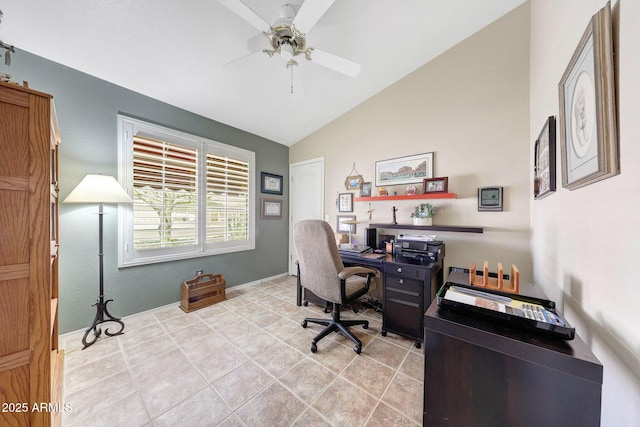 home office featuring lofted ceiling, ceiling fan, and light tile patterned floors