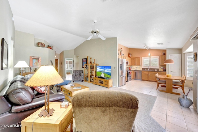 living area featuring light tile patterned flooring, ceiling fan, and lofted ceiling