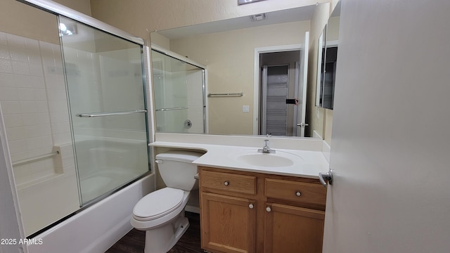 full bathroom with vanity, toilet, and enclosed tub / shower combo