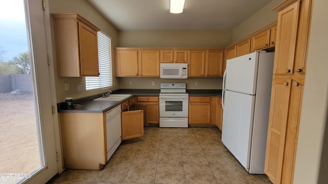 kitchen featuring sink and white appliances