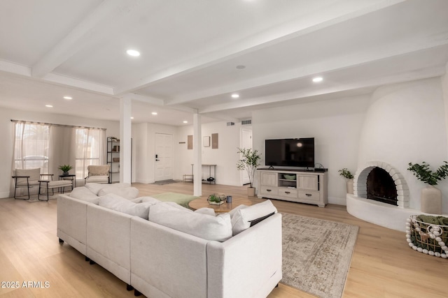 6835 E Friess Dr, Scottsdale, AZ 85254 - living area featuring light wood-type flooring, recessed lighting, beamed ceiling, baseboards, and a fireplace