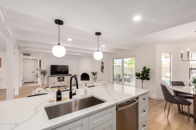 6835 E Friess Dr, Scottsdale, AZ 85254 - kitchen featuring dishwasher, a sink, light wood-type flooring, open floor plan, and recessed lighting