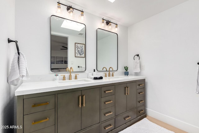 6835 E Friess Dr, Scottsdale, AZ 85254 - bathroom with double vanity and baseboards
