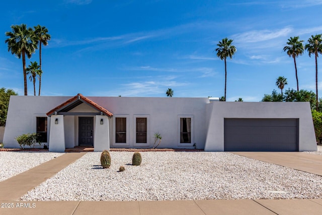 6835 E Friess Dr, Scottsdale, AZ 85254 - view of front of property featuring an attached garage, stucco siding, and driveway