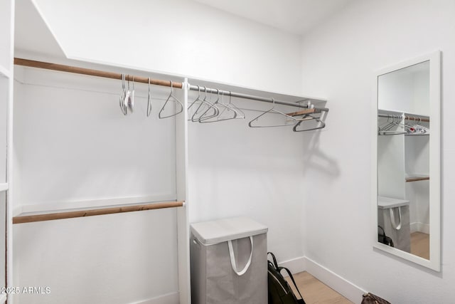 6835 E Friess Dr, Scottsdale, AZ 85254 - spacious closet featuring wood finished floors