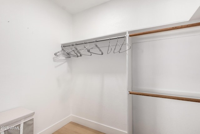 6835 E Friess Dr, Scottsdale, AZ 85254 - walk in closet with light wood-style floors