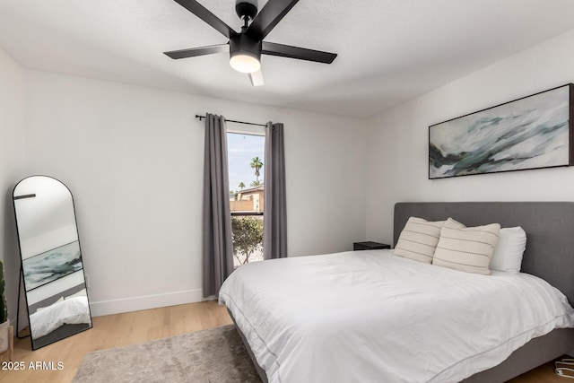 6835 E Friess Dr, Scottsdale, AZ 85254 - bedroom featuring light wood-type flooring, baseboards, and ceiling fan
