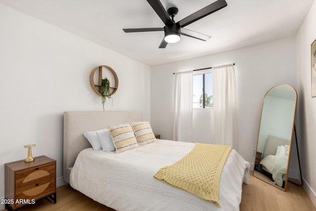 6835 E Friess Dr, Scottsdale, AZ 85254 - bedroom with light wood-type flooring and a ceiling fan