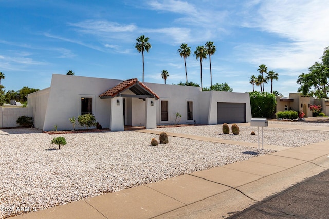 6835 E Friess Dr, Scottsdale, AZ 85254 - view of front of house featuring an attached garage, stucco siding, and concrete driveway