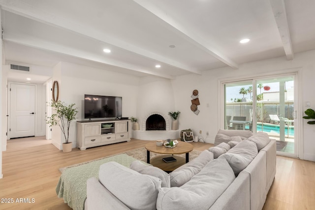 6835 E Friess Dr, Scottsdale, AZ 85254 - living area featuring beamed ceiling, light wood finished floors, and recessed lighting