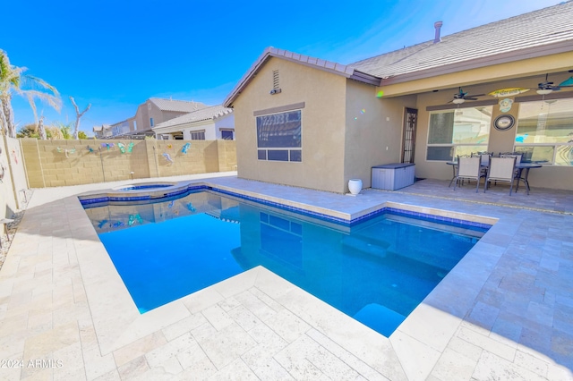 view of pool featuring a patio area, an in ground hot tub, and ceiling fan