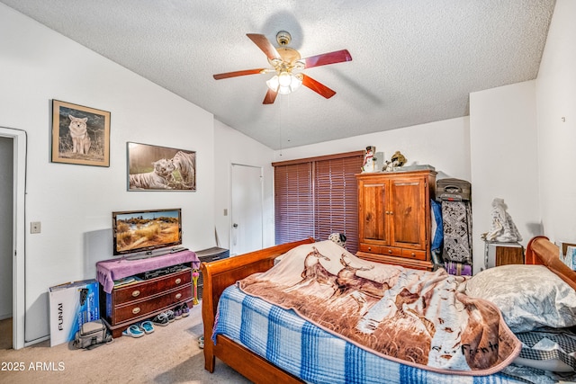 carpeted bedroom featuring a ceiling fan, a textured ceiling, and lofted ceiling