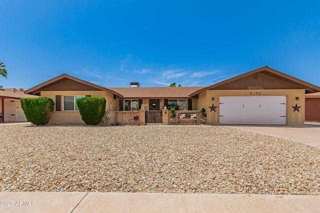 4145 W Hayward Ave, Phoenix, AZ 85051 - single story home featuring a garage, concrete driveway, stucco siding, and fence