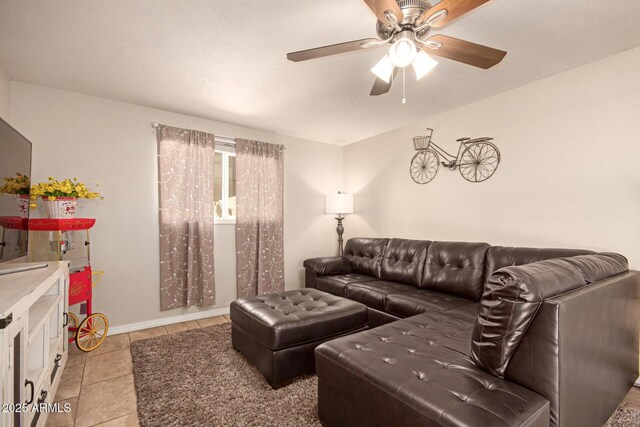 4145 W Hayward Ave, Phoenix, AZ 85051 - living room featuring a ceiling fan, light tile patterned floors, and baseboards