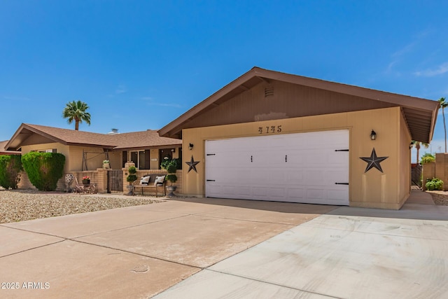 4145 W Hayward Ave, Phoenix, AZ 85051 - ranch-style house with an attached garage and driveway