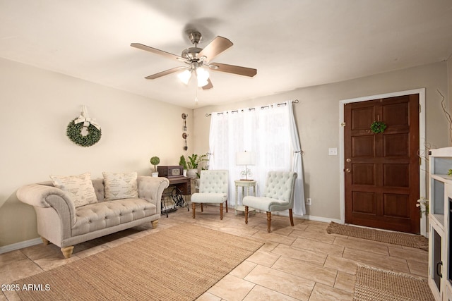 4145 W Hayward Ave, Phoenix, AZ 85051 - living room featuring a ceiling fan and baseboards