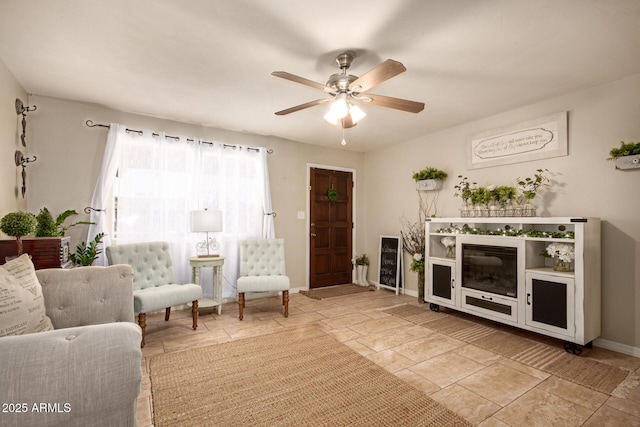 4145 W Hayward Ave, Phoenix, AZ 85051 - living area featuring baseboards and a ceiling fan