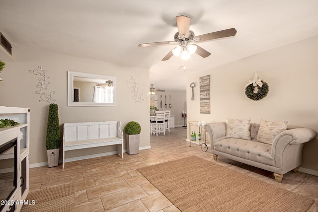 4145 W Hayward Ave, Phoenix, AZ 85051 - living room featuring ceiling fan and baseboards