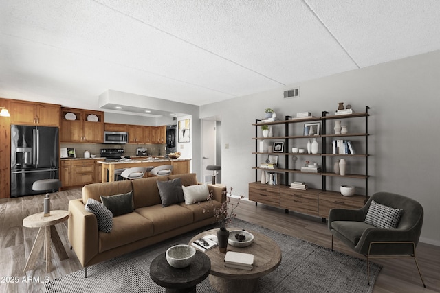 living room featuring dark wood-type flooring