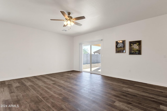 unfurnished room featuring ceiling fan and dark hardwood / wood-style flooring