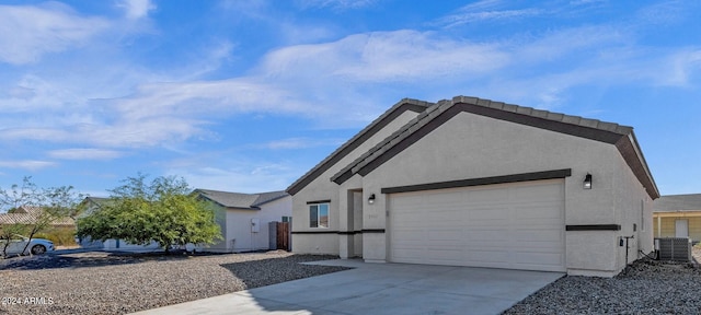 view of front of house featuring cooling unit and a garage