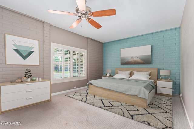 bedroom with brick wall, ceiling fan, and carpet