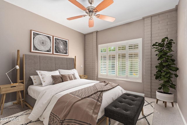 bedroom with light carpet and ceiling fan