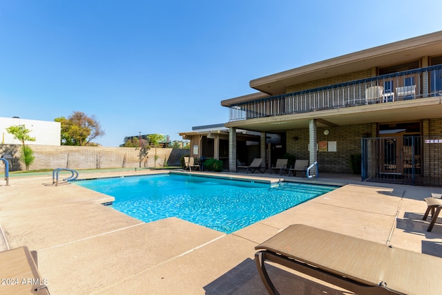 view of pool featuring a patio