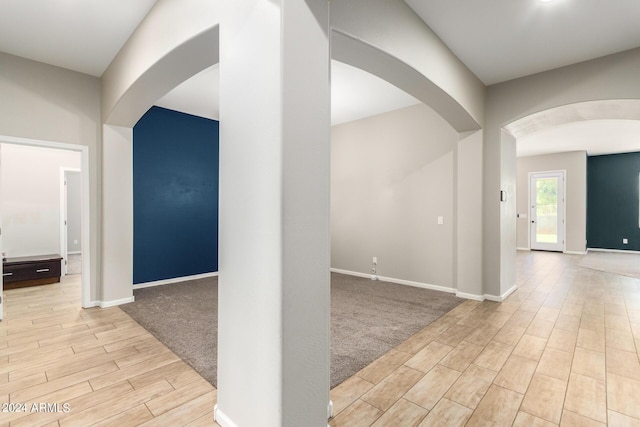 hallway with light carpet