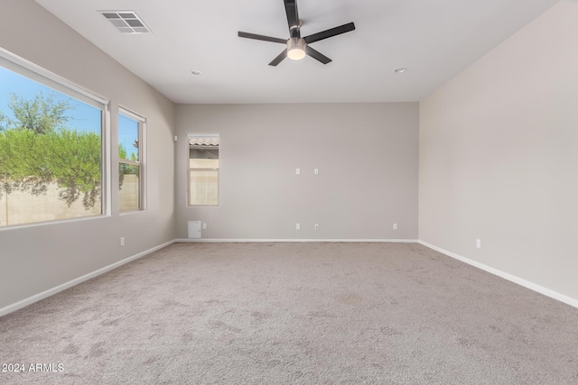 spare room with carpet and ceiling fan