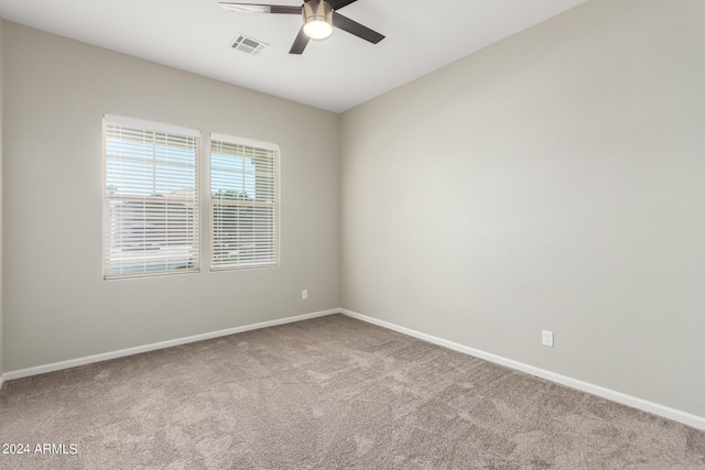 carpeted empty room with ceiling fan