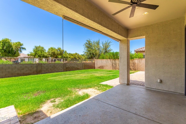 view of yard featuring a patio and ceiling fan