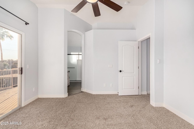 unfurnished bedroom featuring carpet floors, access to exterior, ensuite bath, and baseboards