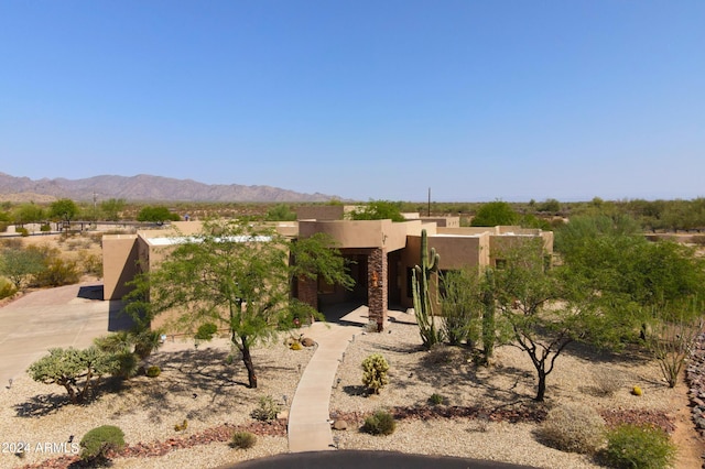 pueblo-style home with a mountain view