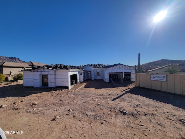 back of property featuring a mountain view