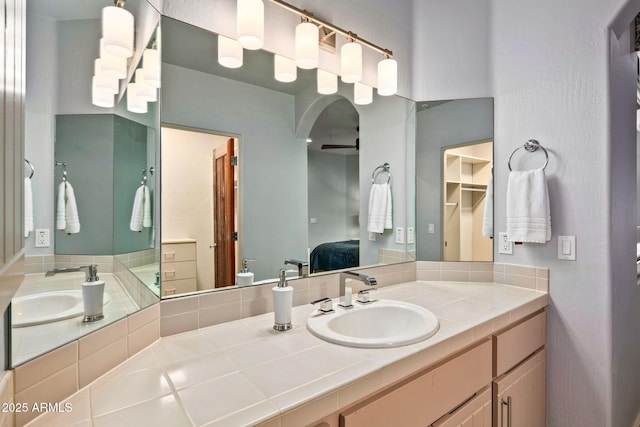 bathroom featuring vanity and ceiling fan