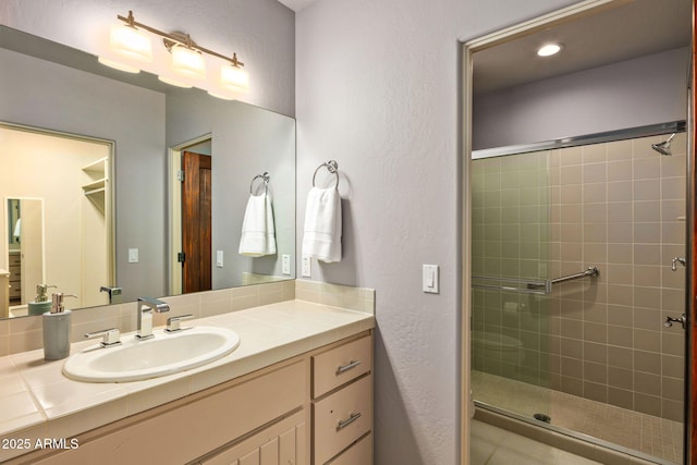 bathroom featuring vanity and walk in shower