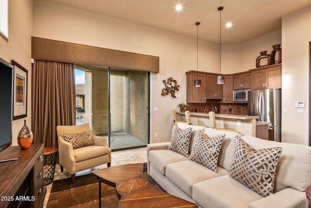 living room featuring a high ceiling